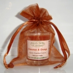  The three wise men Gold organza gift bag,
 with a cinnamon and orange candle in a glass. 